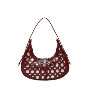 Dark red leather hobo bag with silver rivets and double zipper on white background