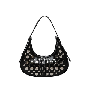 Glossy black crescent shoulder bag with silver metallic rivets and punk style design