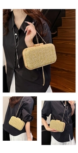 Detailed view of handmade straw clutch with wooden clasp and gold chain strap
