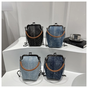 Detail of four denim mini bags in black and blue shades with metallic glitter finish