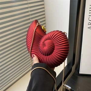Unique wine red conch shell clutch bag with gold chain strap and spiral texture