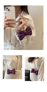 Detailansicht der lila Schleifen-Umhängetasche mit elegantem Goldkettenriemen