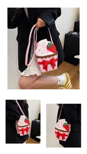 Detail of pink strawberry cupcake bag featuring white cream layer and red bow decoration