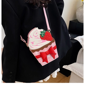 Detail of strawberry cupcake bag with red bow and polka dot pattern for girls