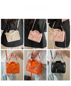 Detailed views of creative biker jacket handbags with metal rivets and zippers