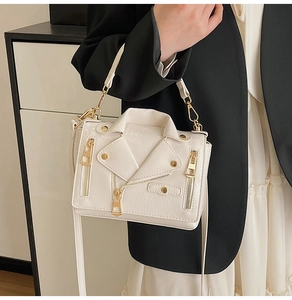 Detailed view of off-white motorcycle jacket style shoulder bag with rivets