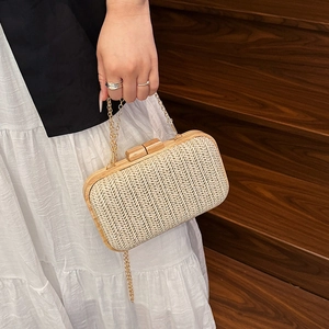 Chic woven straw clutch with wooden frame and gold chain strap for summer parties
