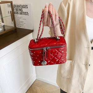 Chic red quilted crossbody bag with sparkling rhinestones and silver chain strap