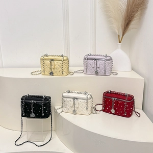 Quilted crossbody flap bags with crystal accents and chain straps in five elegant colors