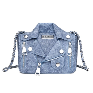 Fashionable denim crossbody bag in motorcycle jacket style with silver rivets and zippers