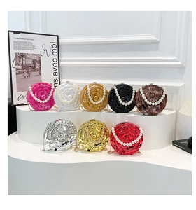 Macro shot of 8 colors of acrylic rose evening bags with pearl handles and chains
