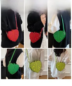 Detailed model views of Monstera leaf cross-body bag in red and green faux leather