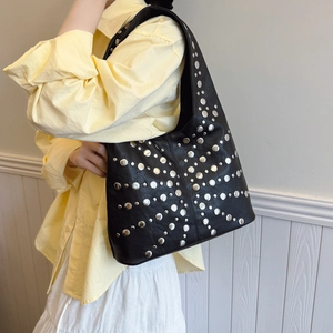 Punk style black shoulder bag with silver star-patterned metal rivets for women