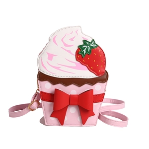 Pink strawberry cupcake crossbody bag with white dots and a large red bow for girls