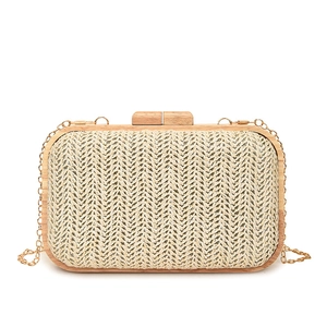 Minimalist straw woven clutch bag with natural wooden frame and gold chain strap