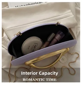 Detail view of the lavender evening bag interior showing space for makeup and lipstick
