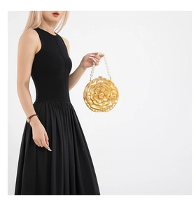 Detailed shot of champagne gold 3D rose acrylic evening clutch with pearl handle