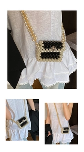 Close-up of pearl woven mini bag featuring camellia metal clasp and gold chain strap