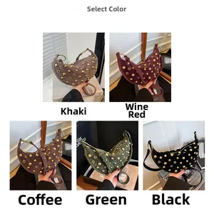 Macro detail of crescent shoulder bags with gold rivets in five stylish suede colors