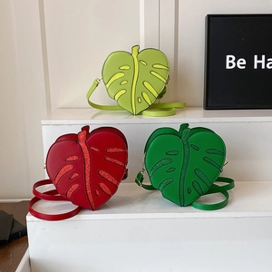 Creative leaf-shaped heart crossbody bag in green and red with shiny sequin details
