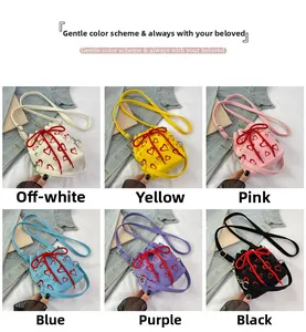 Corduroy bucket bags with heart embroidery shown in six colors with drawstring bows