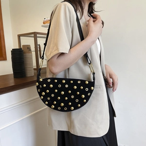 Punk style crescent shoulder bag with gold studs and black suede finish for women