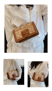 Close-up of vintage brown chain bag showing retro floral fabric and gold metal hardware
