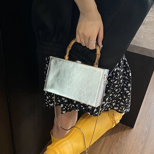 Silver metallic box bag with vintage bamboo handle and gold chain strap for women