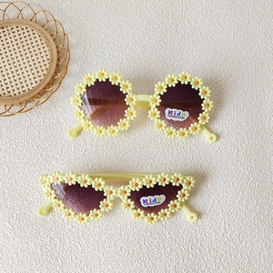 Cute flower-shaped kids sunglasses with UV400 protection for beach and summer travel