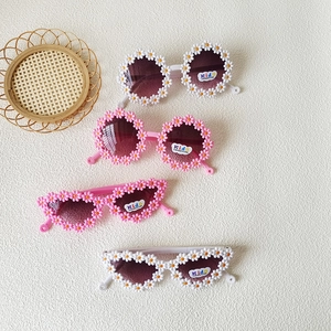 Kids flower-shaped UV400 sunglasses set in pink and white frames for girls and boys