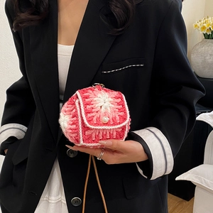 Mini floral crochet crossbody bag with pink petals and a white pearl buckle closure