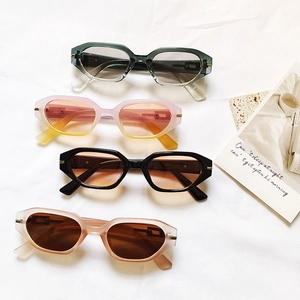 Fashionable geometric small frame sunglasses in four colors on a white textured background
