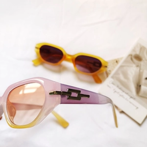 Modern gradient pink and amber small frame sunglasses with retro metal hinge details