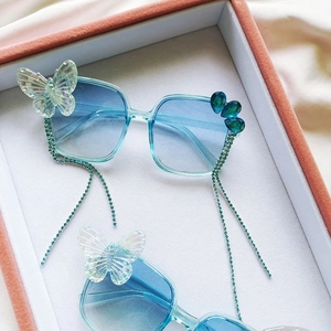 Lunettes de soleil bleues pour enfants avec nœud et pampilles en strass