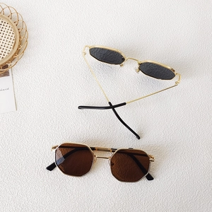 Retro kids metal sunglasses with octagonal frames in gold, black, and brown lenses