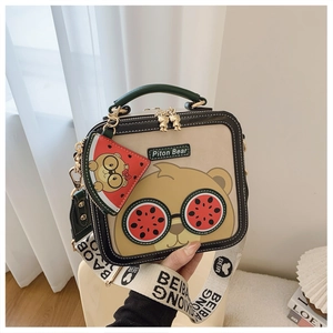 Detail of cartoon bear with watermelon sunglasses on a beige crossbody bag with strap