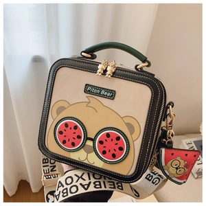 Detail of cute bear crossbody bag with watermelon sunglasses and wide fabric strap