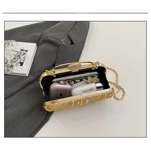 Interior view showing capacity for a phone and lipstick in a sequined pearl evening bag