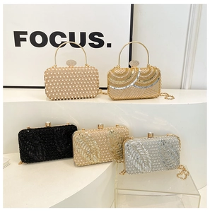Various styles of sequin and pearl evening clutch bags with round metal handles