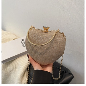 Detail of champagne heart evening bag with sparkling rhinestones and crystal clasp