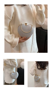 Detailed views of a heart-shaped silver glitter evening bag with gold metal handles