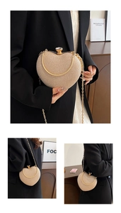 Detail of heart-shaped evening clutch featuring sparkling sequins and crystal clasp lock