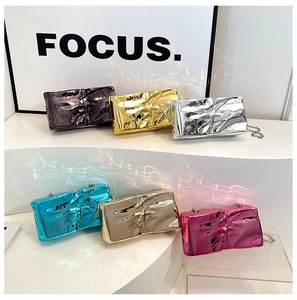 Detail view of colorful wrinkled metal texture acrylic chain bags in six metallic shades