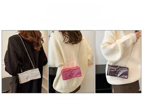Close-up of metallic wrinkled texture box bags in silver, rose pink, and brown with chains