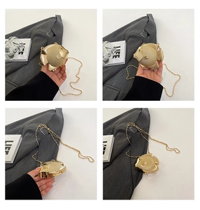 Detailed views of a fish-shaped gold metal mini bag featuring intricate scale textures