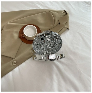 Detail view of the open silver 3D rose acrylic clutch showing internal structure