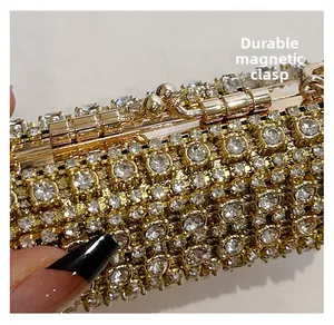 Macro shot of durable magnetic closure and sparkling rhinestones on the evening bag