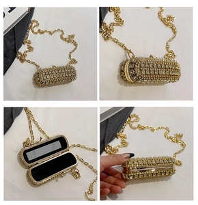 Macro detail of rhinestone evening bag featuring gold chain and built-in vanity mirror