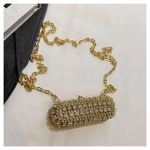 Detail of rhinestone mini evening bag with sparkling crystals and gold chain strap