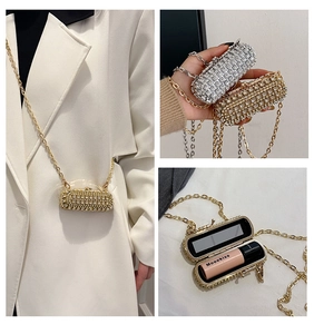 Detailed view of luxury rhinestone mini bag with internal mirror and chain strap